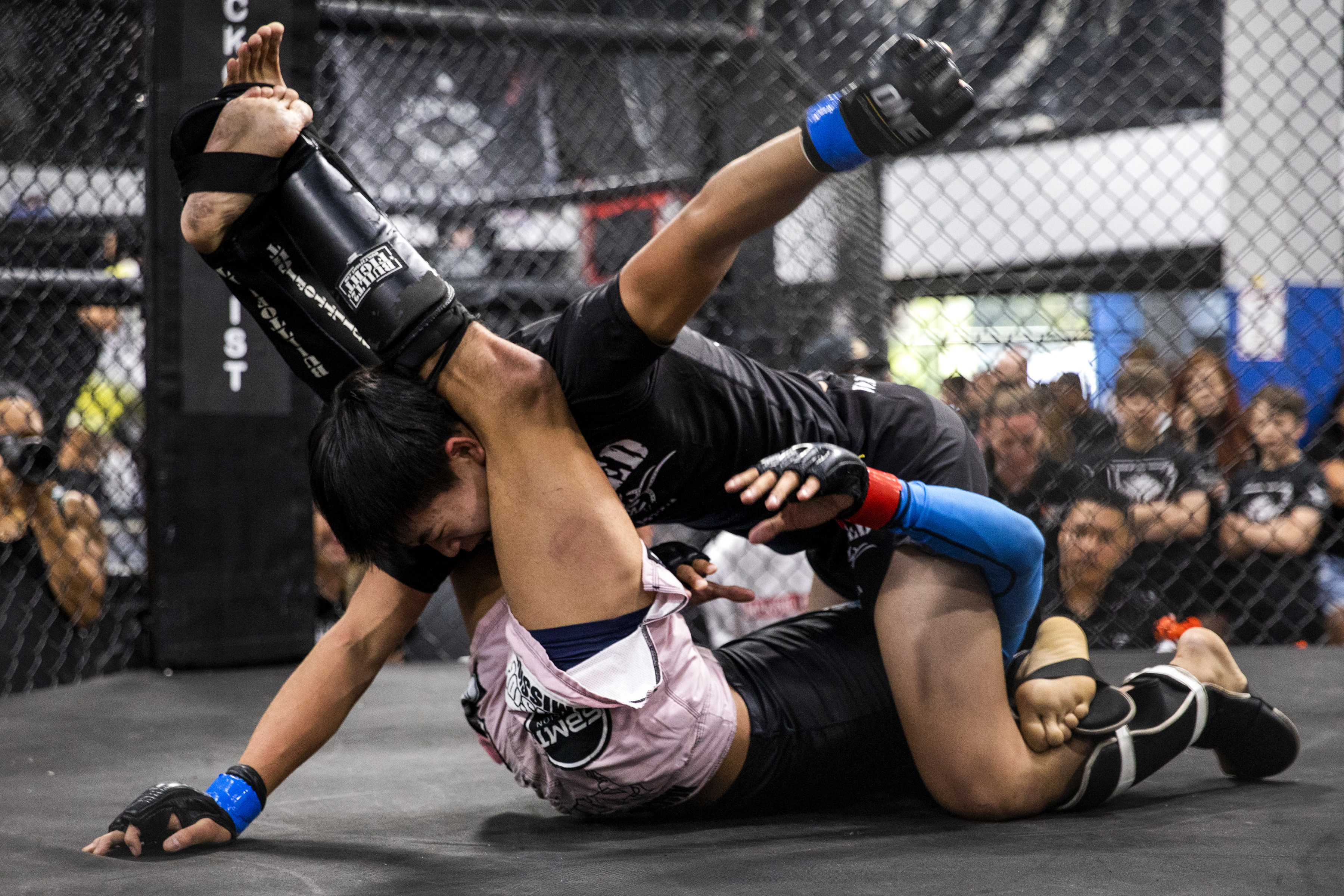 TEMECULA, CA - MAY 14: Adrian Lee, 16, top, swings back for a strike on Kris Arrey, 17, bottom, during the United States Fight League’s National Championships, in Temecula, Calif., on Saturday, May 14, 2022. Lee won his final fight by decision, securing his USFL modern pankration national title and a spot at the International Mixed Martial Arts Federation’s Youth MMA World Championships in Abu Dhabi this summer. (Photo by Alisha Jucevic for The Washington Post)